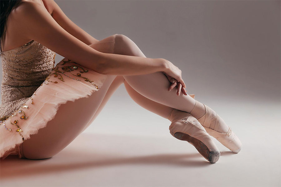 ballerina-pointe-shoes-posing-white-background-studio